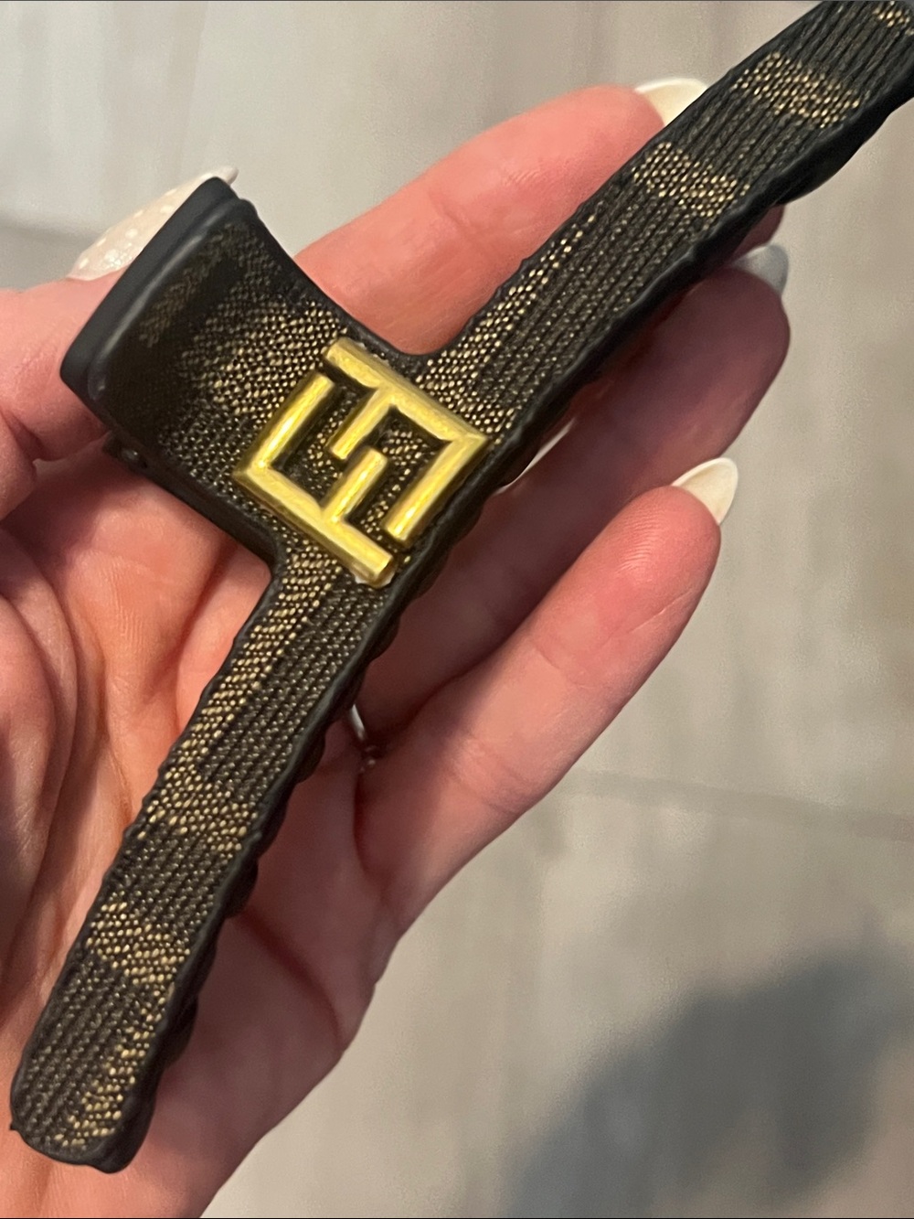 Gold-Accent Black Hair Clip with Signature Interlocking Logo
